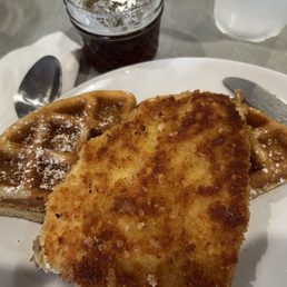 Belgian waffle (half remaining) with pan fried chicken breast added. Belgian waffle (half remaining) with pan fried chicken breast added.