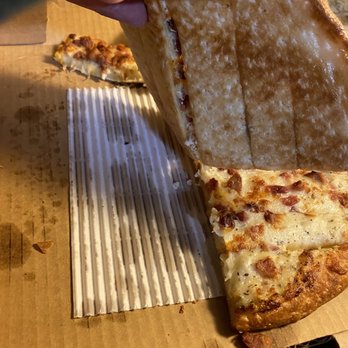 New York Pizza - a slice being taken out of a pizza box - Pizza Near Me - Roseville, California New York Pizza - a slice being taken out of a pizza box - Pizza Near Me - Roseville, California