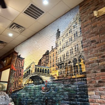 Italian Garden - a brick wall with a painting of a bridge - Italian Near Me - McKinney, Texas Italian Garden - a brick wall with a painting of a bridge - Italian Near Me - McKinney, Texas