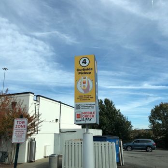 McDonald's - a mcdonald's sign on a pole in a parking lot - Fast Food Near Me - Franklin, Tennessee