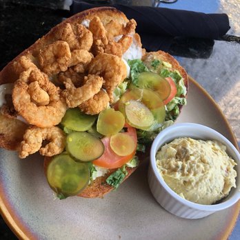 Curio Bistro - Shrimp poboy with a side of potato salad - Cajun/Creole Near Me - New Orleans, Louisiana