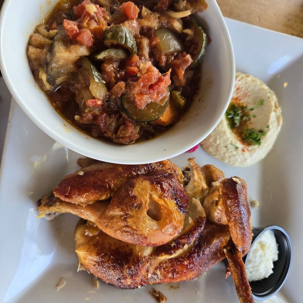 Rosine's Mediterranean Cafe - Half roast chicken with ratatouille and hummus sides - Mediterranean Near Me - Anaheim, California Rosine's Mediterranean Cafe - Half roast chicken with ratatouille and hummus sides - Mediterranean Near Me - Anaheim, California
