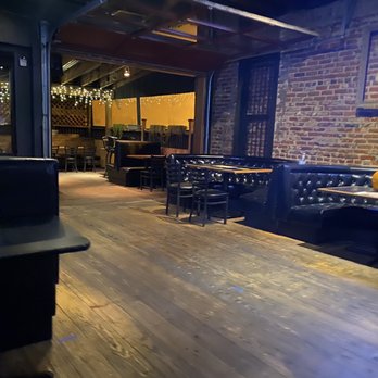 Cap City Tavern - Inside area and Outside patio area with covering - Bars Near Me - Denver, Colorado