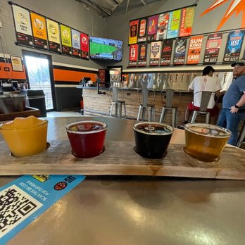 Sun King Brewery - Flight to try out some new flavors! And yes that's a fuzzy navel slushy on the end - Breweries Near Me - Indianapolis, Indiana