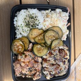 Elua bowl with dynamite poke, crispy garlic poke, kimchi cucumbers, and mac salad Elua bowl with dynamite poke, crispy garlic poke, kimchi cucumbers, and mac salad