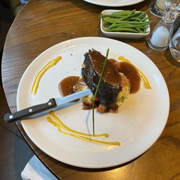Feather blade cut of beef on mashed potatoes.