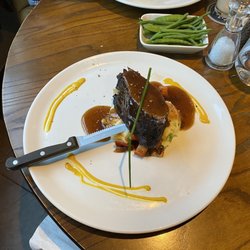Stockhouse - Feather blade cut of beef on mashed potatoes.