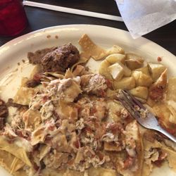 El Palenque Tacos & Grill - The Chiliques with potatoes and beans.