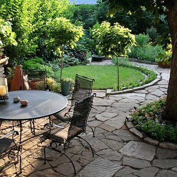 Bellantoni Landscapes - a patio with a table and chairs - Landscaping Near Me - White Plains, New York