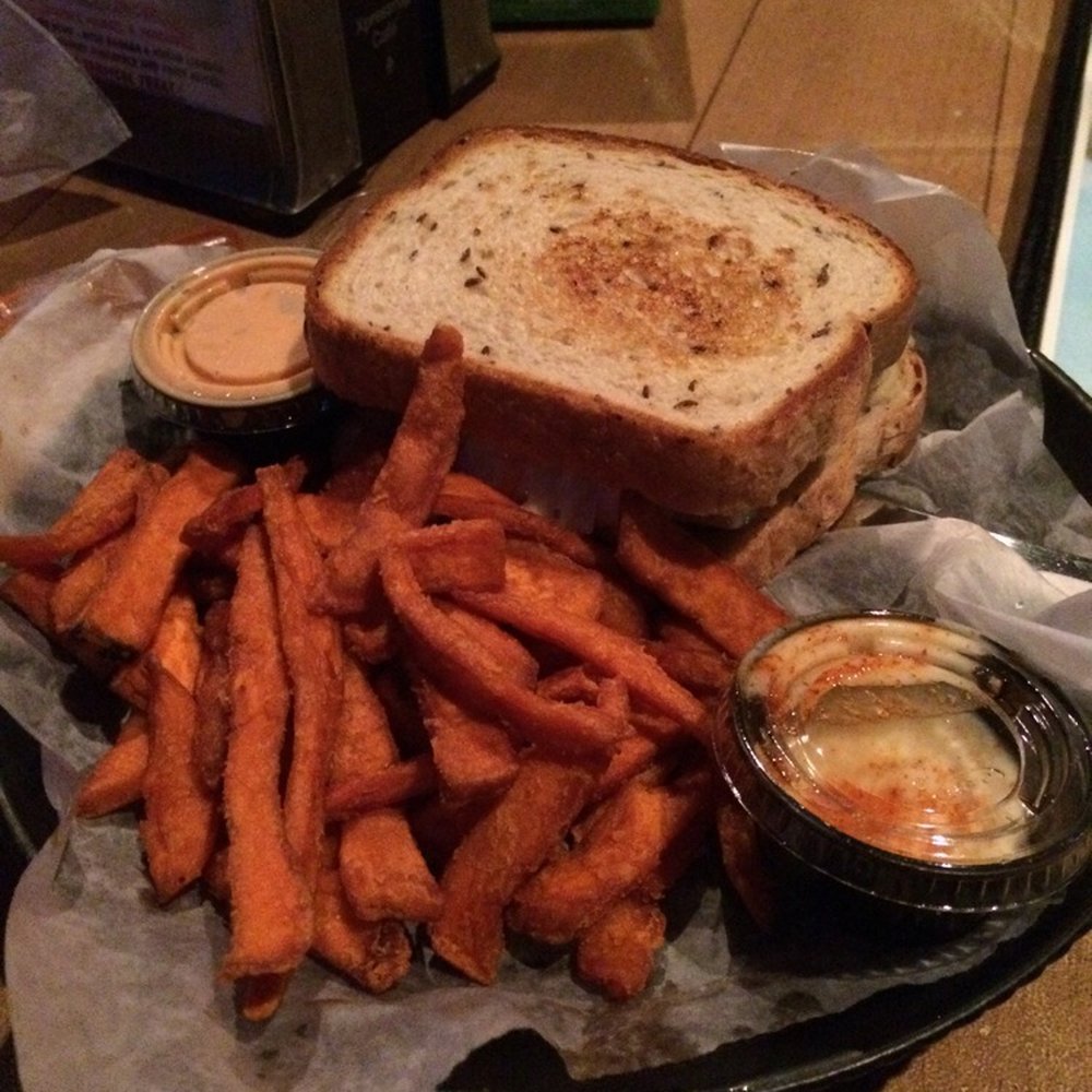 Coconuts On The Beach - Fish Reuben with Sweet Potato fries. Sandwich was great. Fries were ok, but ordinary. They did come with a Tiger Sauce on side. - Bars Near Me - Cocoa Beach, Florida