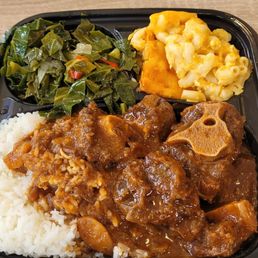 White rice, oxtail, Mac and cheese and collard greens