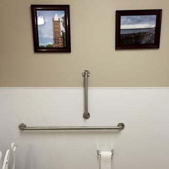 Westminster Brewing - Odd to find art in the bathroom, even odder that it made a face at me. - Breweries Near Me - Westminster, Colorado