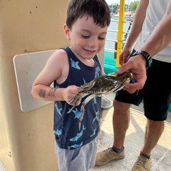 Holding a blue crab we caught!