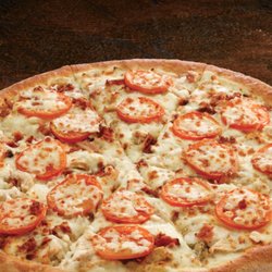 Papa Johns Pizza - CHICKEN BACON RANCH pizza is covered with chicken, bacon, onions and tomatoes on a tangy ranch sauce.