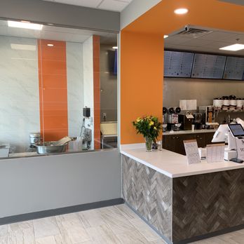 OneZo - a coffee shop with a counter and orange walls - Bubble Tea Near Me - Moore, Oklahoma