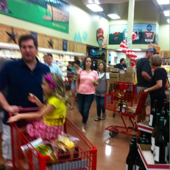 Trader Joe's - Happy people in our long but quick-moving checkout line. - Grocery Near Me - Austin, Texas Trader Joe's - Happy people in our long but quick-moving checkout line. - Grocery Near Me - Austin, Texas