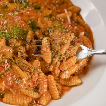 Saddle River Inn - a plate of pasta with meat and broccoli - New American Near Me - Saddle River, New Jersey