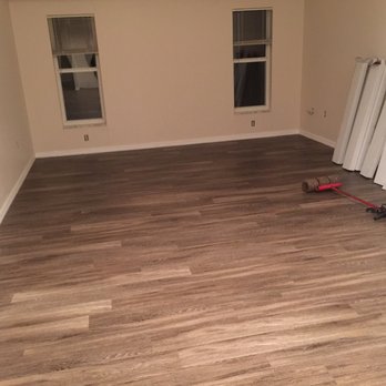 Joe's Carpets - a room with a hard wood floor - Carpeting Near Me - Inverness, Florida