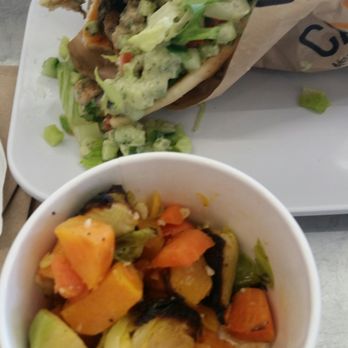 CAVA - Pita loaded with chicken, harissa, tomatoes, cucumbers and a side of veggies - Mediterranean Near Me - Columbia, Maryland