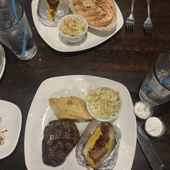 Miller's Seafood & Steakhouse - NC Shrimp and Filet Mignon, both with Loaded Baked Potatoes and Cole Slaw instead of the Broccoli Salad we ordered...oops! - American Near Me - Kill Devil Hills, North Carolina