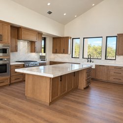Rays Carpet One Floor & Home - Opulux laminate in Aurora in the kitchen of a new build in Escalon.