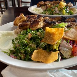 Jerusalem Grill - #5 with kabob, tabouli, Greek salad, pita chips, rice, hummus and some other garlicky dip.