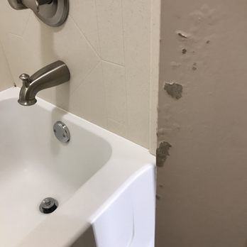 Hampton Inn & Suites Danville - Banged up door and mild in shower corner - Hotels Near Me - Danville, Illinois