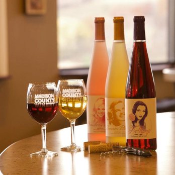 Madison County Winery - three bottles of wine and a glass of wine - Wine Tasting Room Near Me - Saint Charles, Iowa Madison County Winery - three bottles of wine and a glass of wine - Wine Tasting Room Near Me - Saint Charles, Iowa
