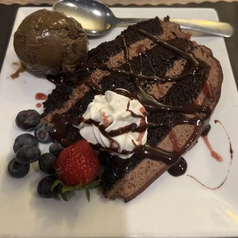 Copper Bottom - Chocolate Mouse Cake w/ Rasberry drizzle, chocolate ice cream, whipped cream and fresh fruit - Bars Near Me - Florida, New York