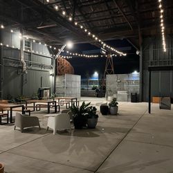 Outdoor seating nearby to eat albeit most seat next to the food truck