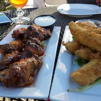 BeachFire Bar & Grille - Beachfire Grille's smoked wings with sweet chili flavor! These were amazing! One the right are Fried Pickle spears! Also very good! - Barbeque Near Me - Ogunquit, Maine