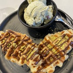 D Spot Dessert Cafe - Croissant waffle with dark chocolate drizzle, pistachios, and pistachio ice cream