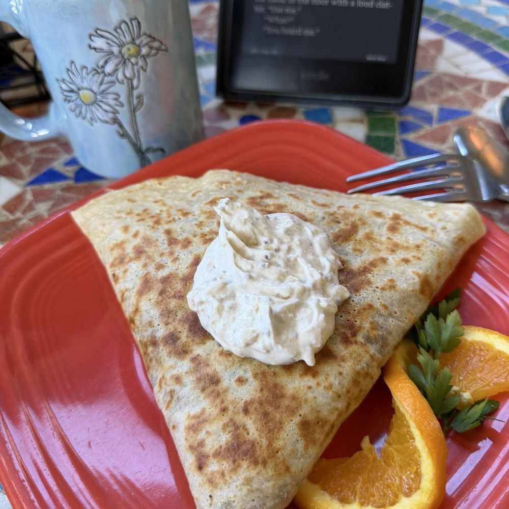 Piping hot latte and a wild mushroom crepe with bacon and Gruyère cheese with a garlic cream. Piping hot latte and a wild mushroom crepe with bacon and Gruyère cheese with a garlic cream.