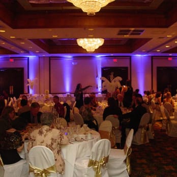 Magical Music Karaoke Shows - Uplighting adds accents to an otherwise neutral-colored wall. Here, we incorporated the bride's purple color scheme for flair! - Karaoke Near Me - Morganton, North Carolina Magical Music Karaoke Shows - Uplighting adds accents to an otherwise neutral-colored wall. Here, we incorporated the bride's purple color scheme for flair! - Karaoke Near Me - Morganton, North Carolina