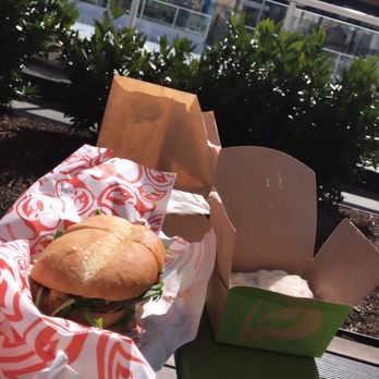 Nando's Peri-Peri - Chicken sandwich on the outside patio by the ice rink - Portuguese Near Me - Arlington, Virginia Nando's Peri-Peri - Chicken sandwich on the outside patio by the ice rink - Portuguese Near Me - Arlington, Virginia