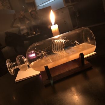 The Aviary - Gotta love this "ship in a bottle" cocktail. Such a unique and visually stimulating presentation! - Cocktail Bars Near Me - Chicago, Illinois The Aviary - Gotta love this "ship in a bottle" cocktail. Such a unique and visually stimulating presentation! - Cocktail Bars Near Me - Chicago, Illinois