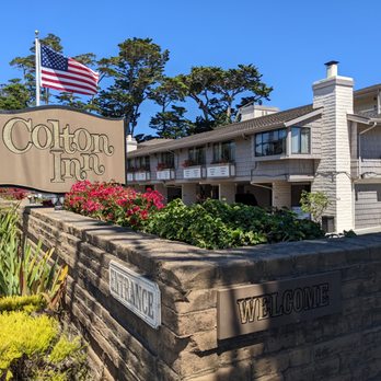 Colton Inn - Outside. Street sign with American flag. - Hotels Near Me - Monterey, California Colton Inn - Outside. Street sign with American flag. - Hotels Near Me - Monterey, California