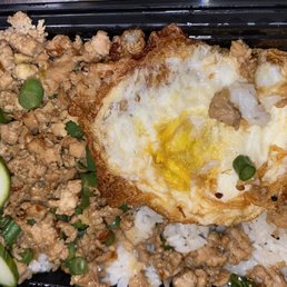 Pad ka prow - ground chicken stir fried with Thai basil and spicy garlic sauce. It is served with rice and topped up with fried egg.