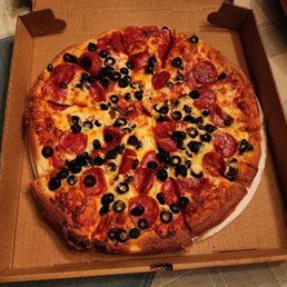 a pepperoni and olive pizza a pepperoni and olive pizza