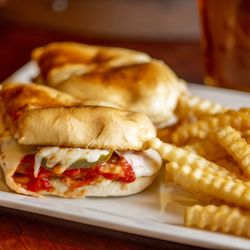 Stromboli: grilled beef steak hoagie topped with white onions, pickles, marinara & mozzarella on a hoagie bun