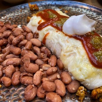 La Plazuela - New Mexico Burrito with Christmas Chile and sour cream.  I traded black beans for pinto beans! - New American Near Me - Santa Fe, New Mexico