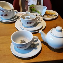 Costa Coffee - Table not cleared for me to sit down. I stacked these up myself. The cup and teapot are mine tge rest is not