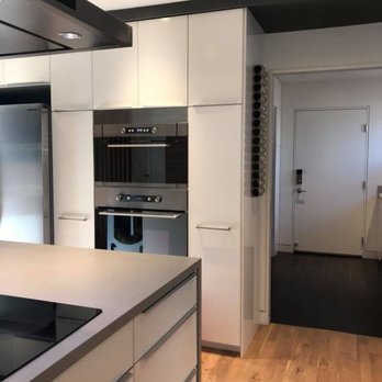 Howard Lamcke - a kitchen with white cabinets and stainless steel appliances - General Contractors Near Me - Campbell, California