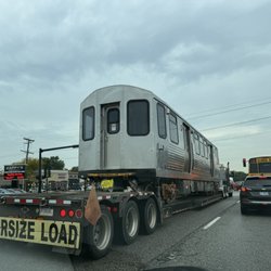 Dempster-Skokie - A very unusual sighting: 2 brand new CTA rail cars being transported on flat bed carriers on Dempster St.