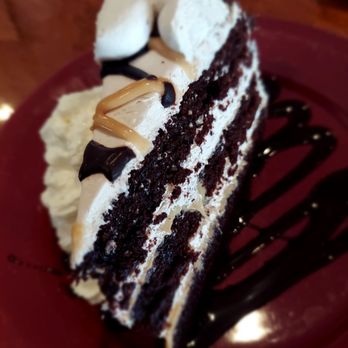 Shooter's Restaurant & Tavern - a slice of cake on a red plate - Pizza Near Me - Belmont, New Hampshire Shooter's Restaurant & Tavern - a slice of cake on a red plate - Pizza Near Me - Belmont, New Hampshire