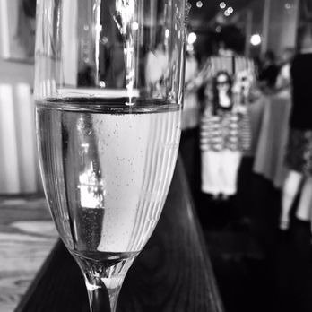 The Eden - a glass of wine on a bar - French Near Me - Calgary, Alberta The Eden - a glass of wine on a bar - French Near Me - Calgary, Alberta