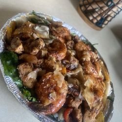 Chef Walt’s - Marcus Special with 3 extra shrimp . This plate was FILLED! Shrimp were cooked well ,very flavorful, lots of veggies and greens .