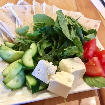 Lavash - Complimentary appetizer with lavash bread , cucumbers , feta cheese , tomatoes and mint leaves . Tasty and refreshing. - Persian/Iranian Near Me - San Francisco, California Lavash - Complimentary appetizer with lavash bread , cucumbers , feta cheese , tomatoes and mint leaves . Tasty and refreshing. - Persian/Iranian Near Me - San Francisco, California
