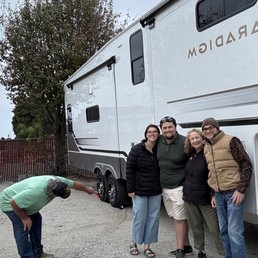 My husband and I with our kids and my brother the day we brought our Fifth Wheel home thanks to Tyler's excellent lessons.