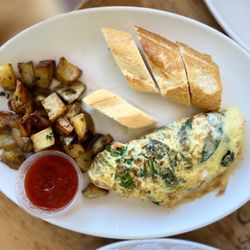 Spinach omelette with breakfast potatoes